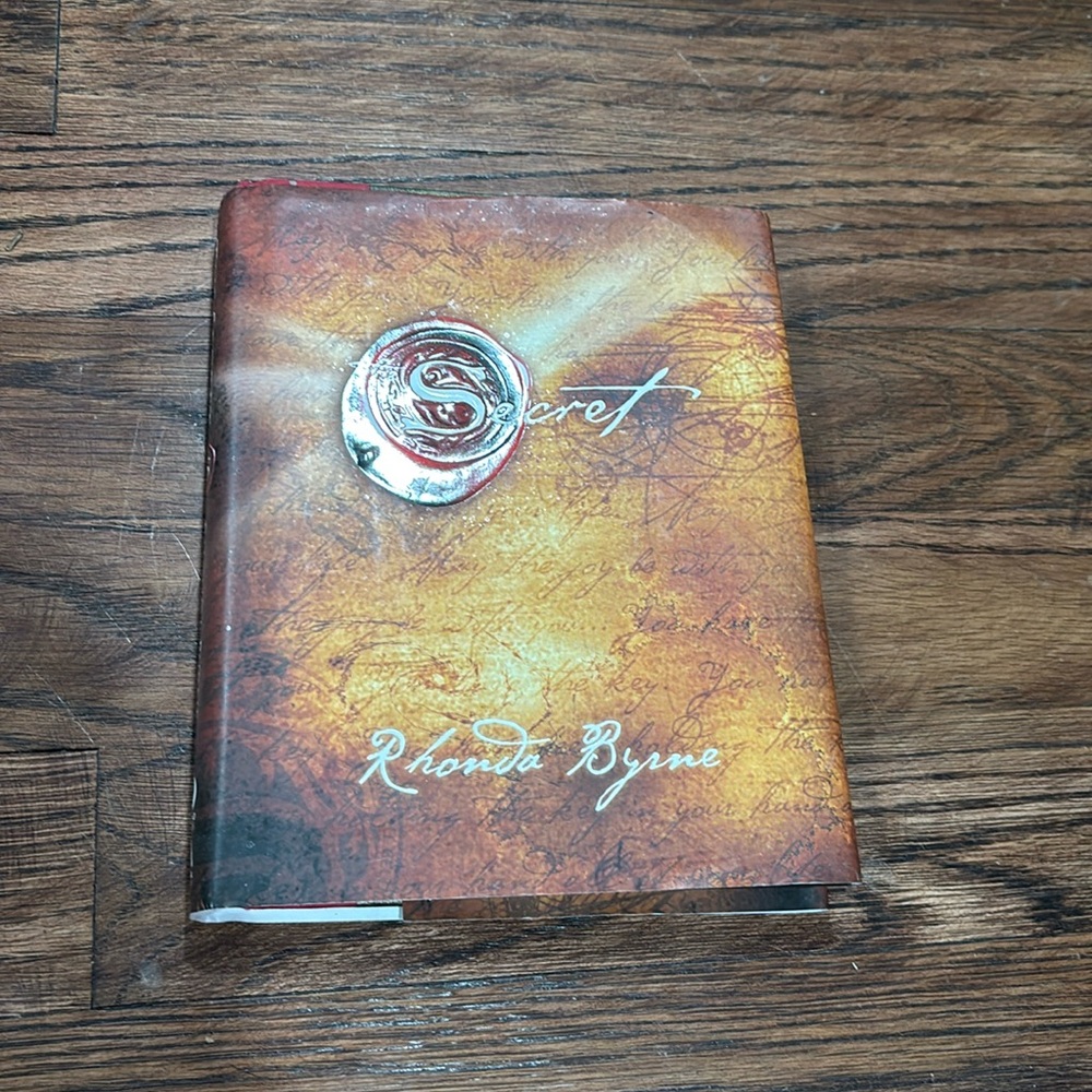 The Secret By Rhonda Byrne hard cover reading book reading